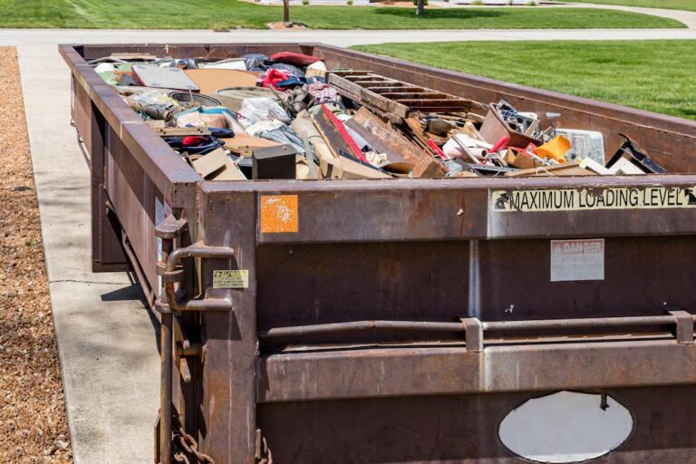 Garbage, trash or waste dumpster full of household junk.