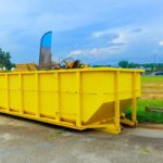 Construction site dumpsters of metal containers for collection of waste during construction